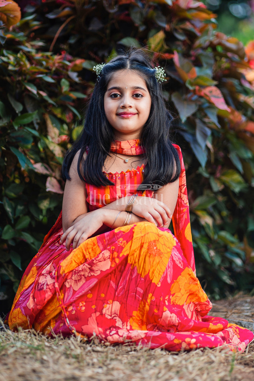 The Nesavu Girls Lehenga Choli Girls Red and Orange Lehenga Choli with Bold Floral Print and Striped Choli Top Nesavu Nesavu Girls Red Orange Floral Lehenga Choli Striped Choli Top Dupatta