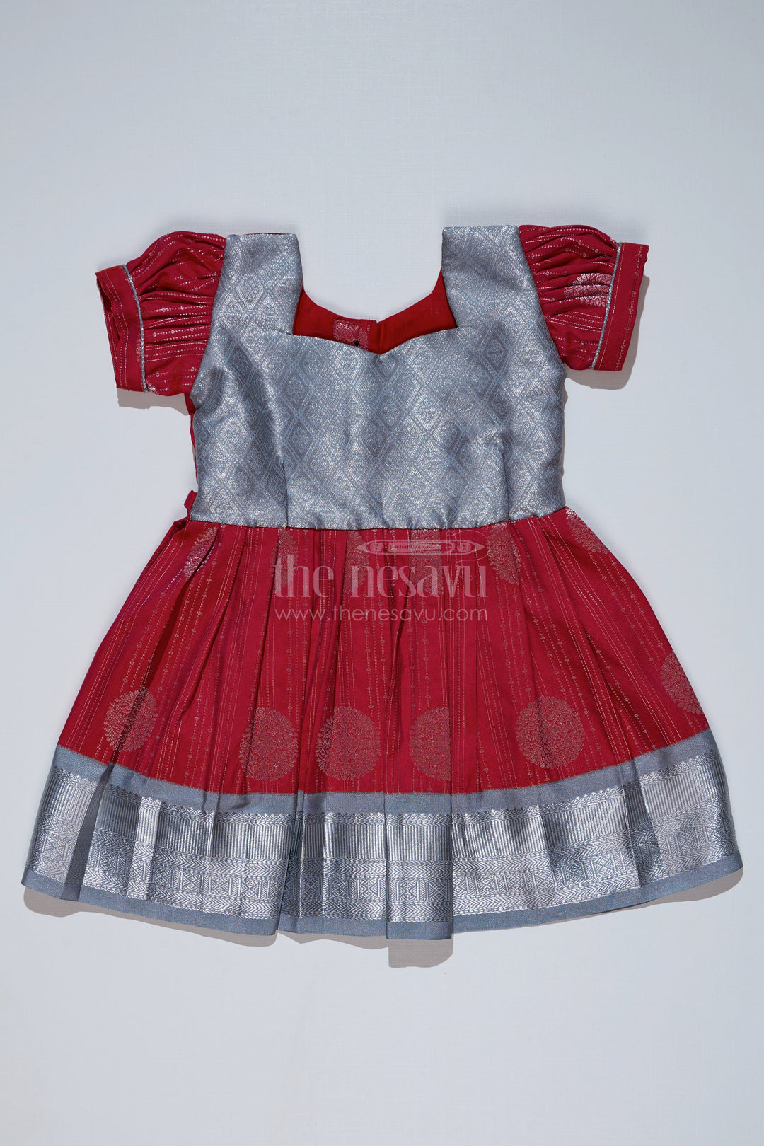 The Nesavu Girls Kanchi Silk Frock Girls Red and Silver Pattu Pavadai with Zari Border and Elegant Pleated Skirt Available Online Nesavu Girls Red Silver Pattu Pavadai Zari Border Elegant Pleated Skirt Online | The Nesavu