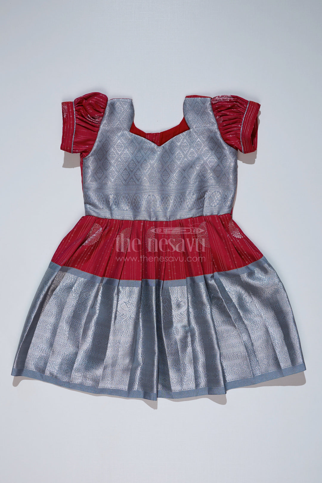 The Nesavu Girls Kanchi Silk Frock Girls Red and Silver Pattu Pavadai with Zari Border and Elegant Pleated Skirt Available Online Nesavu Girls Red Silver Pattu Pavadai Zari Border Elegant Pleated Skirt Online | The Nesavu