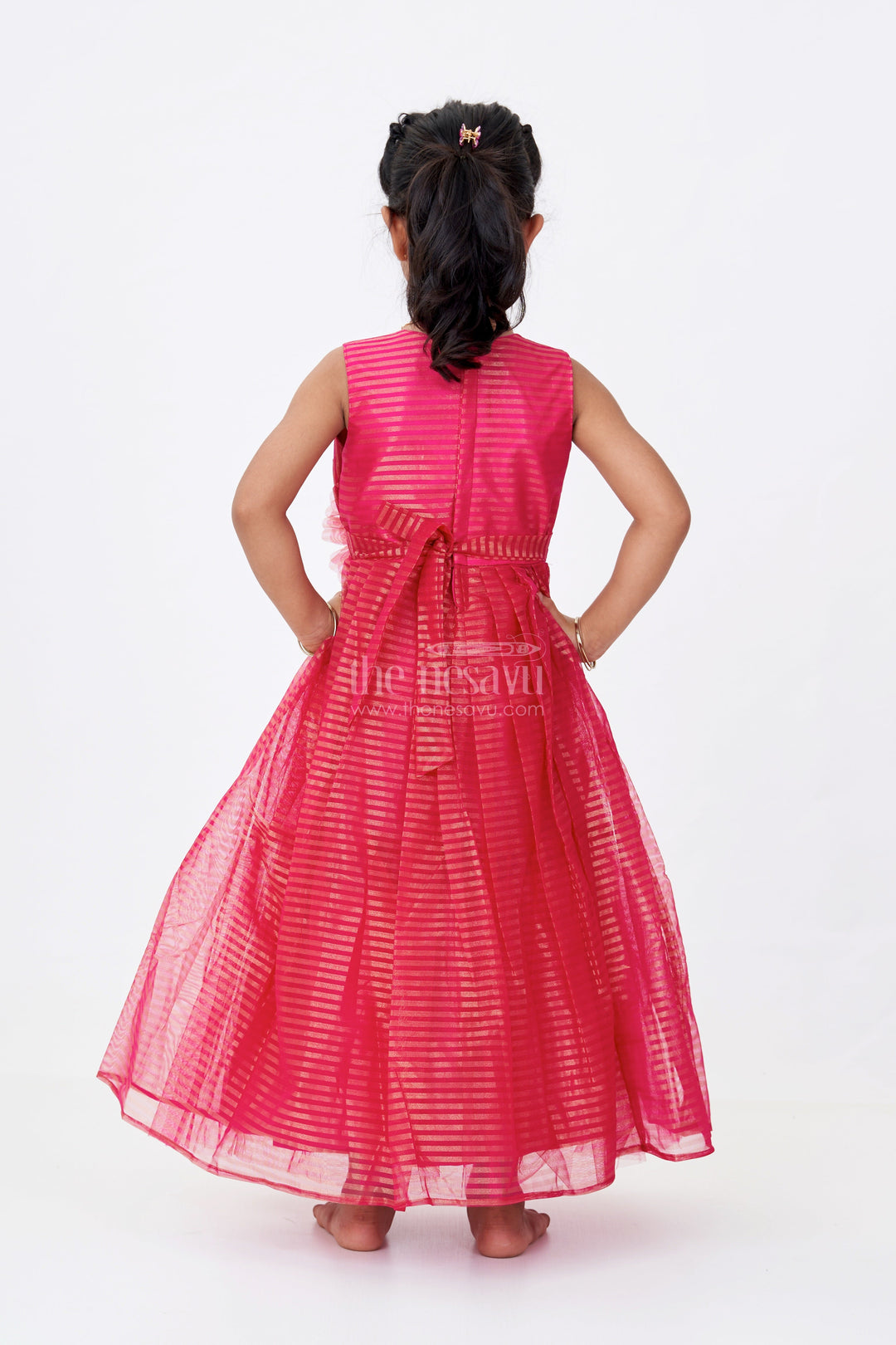 The Nesavu Girls Silk Gown Girls Red Silk Gown in Soft Net with Stripe Design and Oversized Floral Waist Embellishment Nesavu Girls Red Silk Gown Soft Net Gold Stripes Waist Flower Detail | The Nesavu