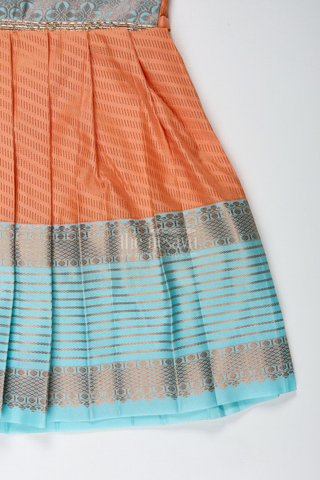 The Nesavu Tie-up Frock Girls Semi Kanchipuram Silk Tie-Up Frock in Grey-Orange Festive Traditional Wear Nesavu Semi Kanchipuram Silk Frock For Girls Grey And Orange Tie-Up Design