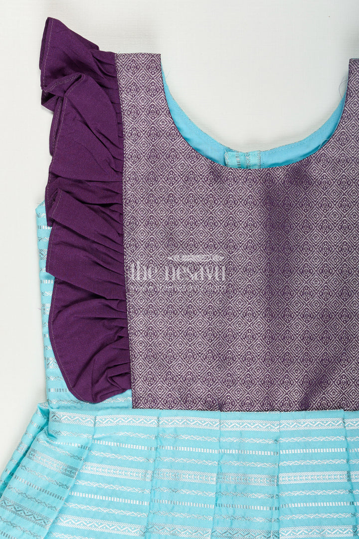 The Nesavu Girls Kanchi Silk Frock Girls Semi Kanchivaram Silk Frock with Layered Puff Sleeves and Contrast Borders in Pleated Dress Style Nesavu Nesavu Girls pleated dress Style Kanchi Silk Frock with Aqua Green Pleats and Purple Zari Borders