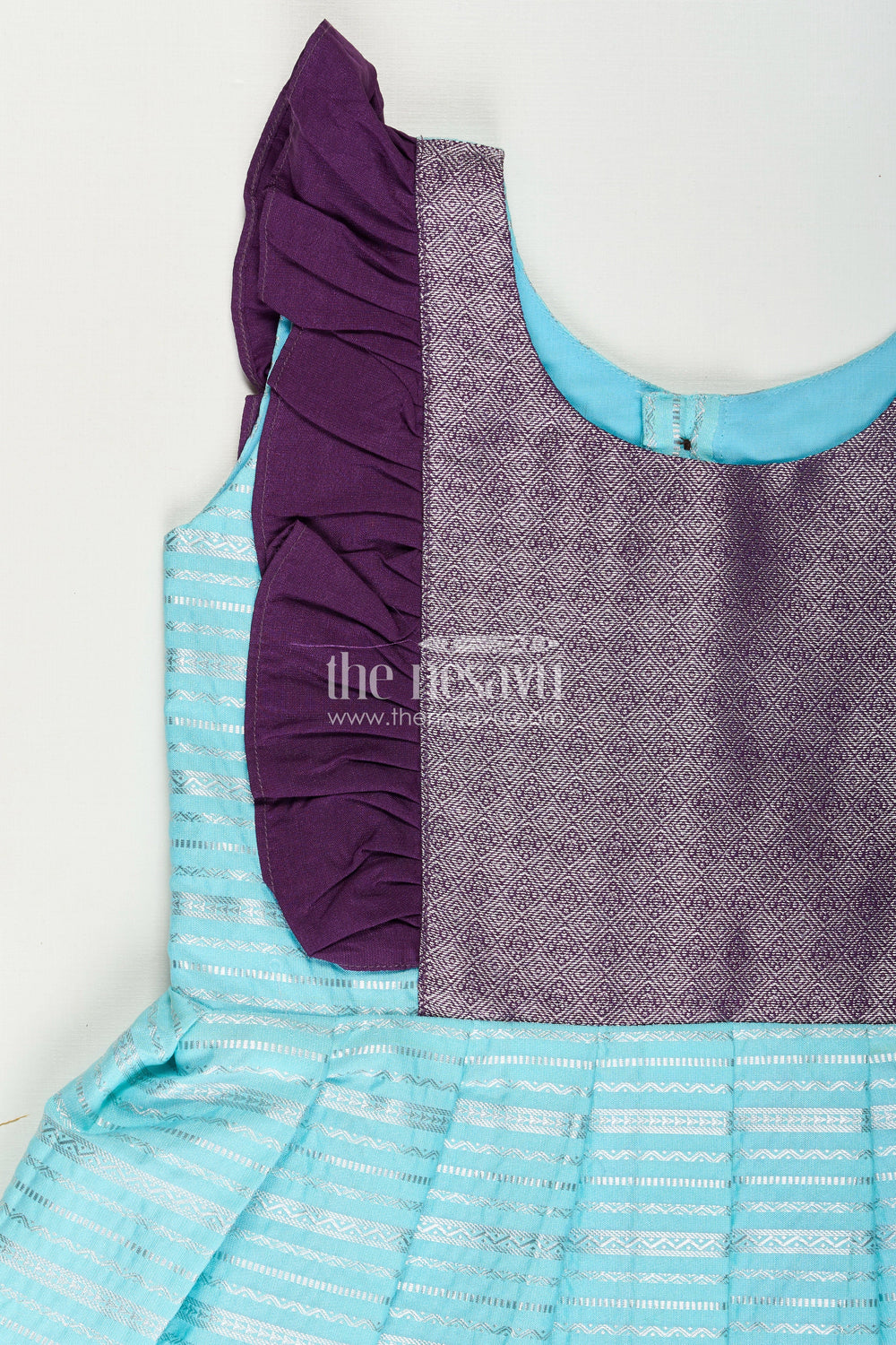 The Nesavu Girls Kanchi Silk Frock Girls Semi Kanchivaram Silk Frock with Layered Puff Sleeves and Contrast Borders in Pleated Dress Style Nesavu Nesavu Girls pleated dress Style Kanchi Silk Frock with Aqua Green Pleats and Purple Zari Borders
