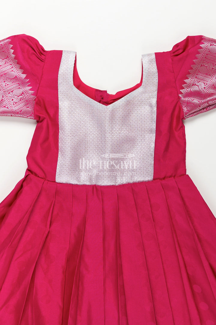 The Nesavu Girls Silk Gown Girls Semi Silk Pink Gown Design with Embellished Yoke and Traditional Zari Border Nesavu Girls Semi Silk Pink Gown Design Silver Yoke Puff Sleeves Traditional Festivities | The Nesavu