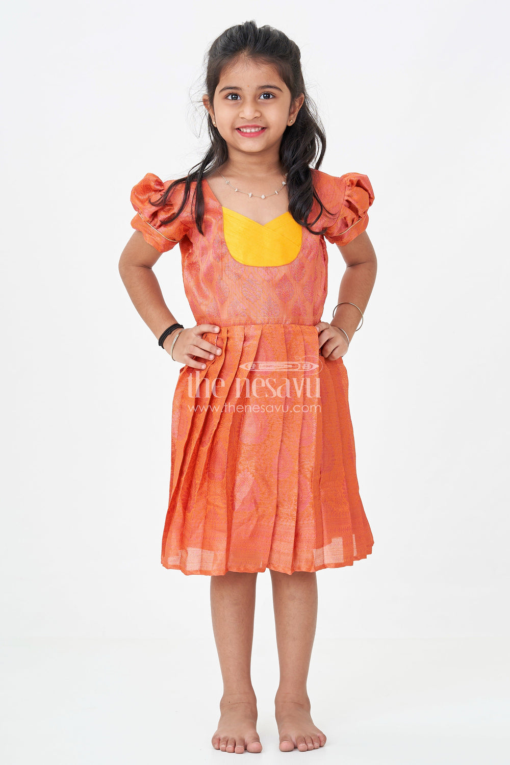 The Nesavu Silk Frock Girls Semi Silk Pure Silk Frock in Orange with Yellow Yoke and Brocade Pleated Skirt Nesavu Nesavu Girls Semi Silk Pure Silk Frock Orange Yellow Yoke Traditional Brocade Detailing