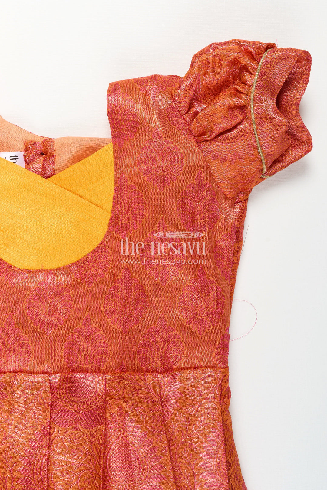 The Nesavu Silk Frock Girls Semi Silk Pure Silk Frock in Orange with Yellow Yoke and Brocade Pleated Skirt Nesavu Nesavu Girls Semi Silk Pure Silk Frock Orange Yellow Yoke Traditional Brocade Detailing