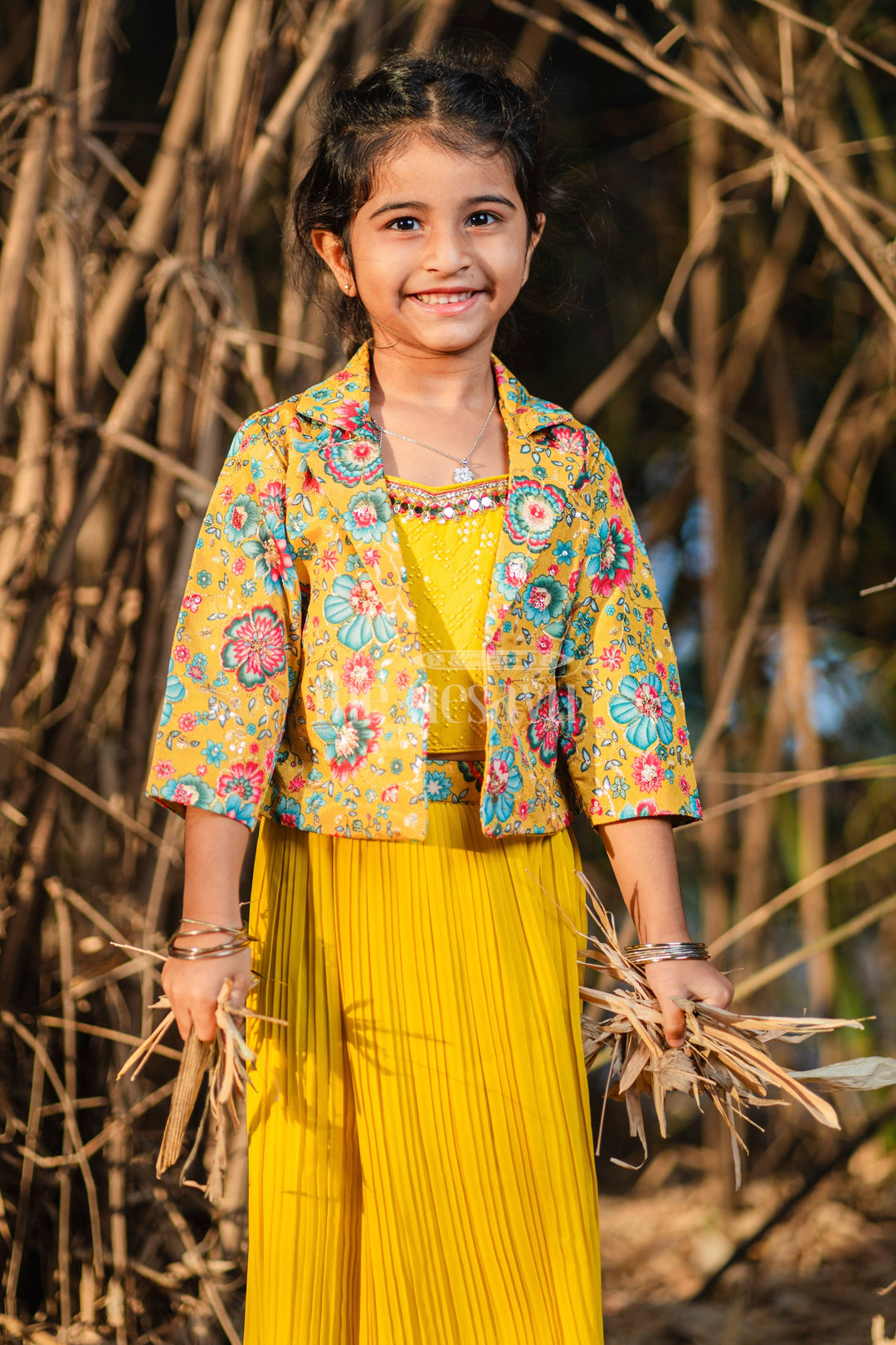 The Nesavu Girls Sharara / Plazo Set Girls Sharara Set in Vibrant Yellow with Floral-Printed Jacket and Palazzo Pants Nesavu Nesavu Girls Yellow Sharara Set Floral Jacket Pleated Palazzo Pants