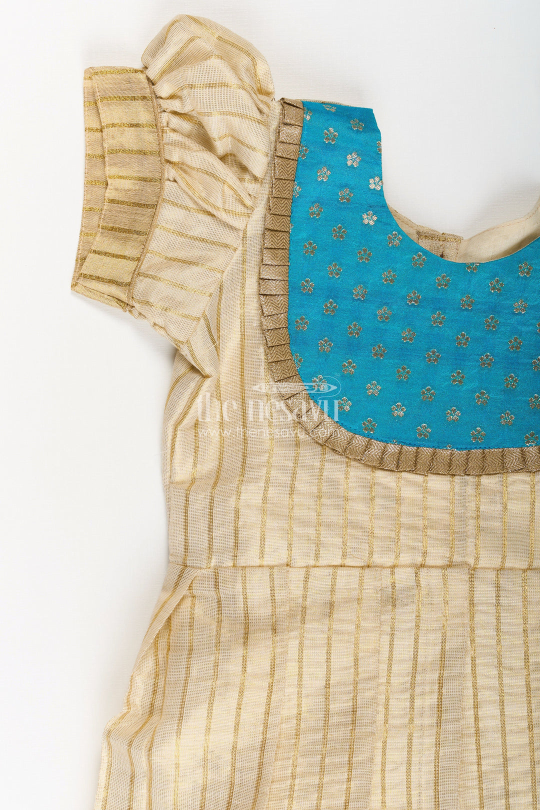The Nesavu Silk Frock Girls Silk Frocks in Beige Tissue with Blue Semi Banaras Yoke and Traditional Pleated Design Nesavu Nesavu Girls Silk Frocks Beige Tissue Blue Banaras Yoke Pleated Traditional Finish