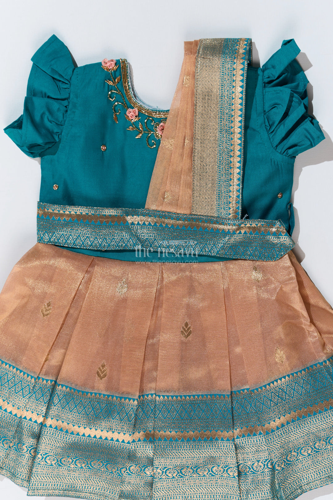 The Nesavu Silk Party Frock Girls Silk Saree to Frock with Traditional Zari Borders in Teal and Peach Nesavu Nesavu Girls Silk Saree to Frock Teal Peach Zari Border Design