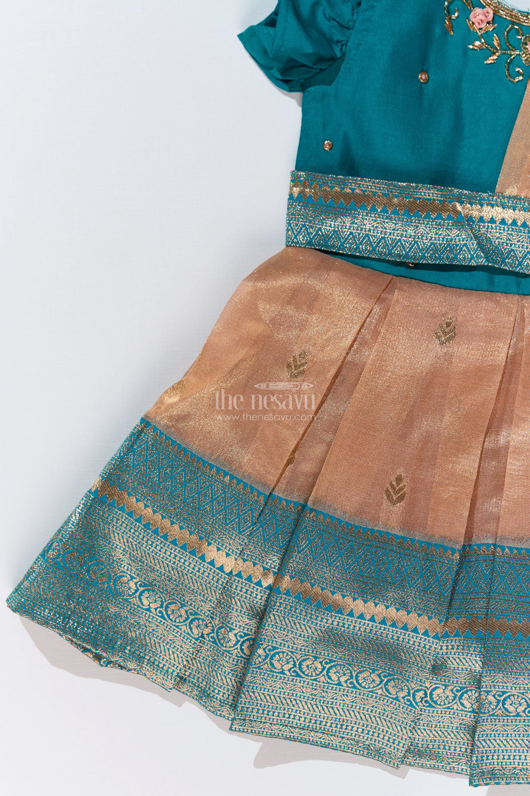 The Nesavu Silk Party Frock Girls Silk Saree to Frock with Traditional Zari Borders in Teal and Peach Nesavu Nesavu Girls Silk Saree to Frock Teal Peach Zari Border Design