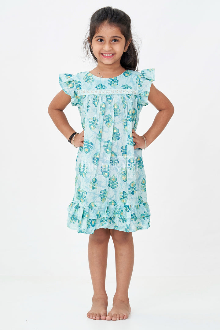 The Nesavu Girls Fancy Frock Girls Sky Blue Frock Design in Rayon with Leaf Motifs and Ruffle Accents for Whimsical Wear Nesavu Nesavu Girls Sky Blue Frock Design Rayon Green Leaf Digital Print Ruffle Hem