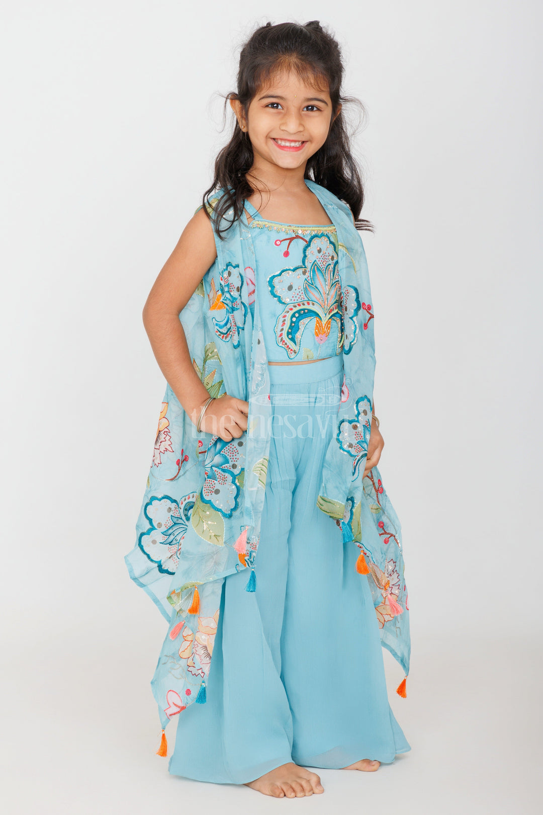 The Nesavu Girls Sharara / Plazo Set Girls Sky Blue Palazzo Set with Floral Embroidery and Tassel-Trimmed Sheer Jacket Nesavu Nesavu Girls Sky Blue Palazzo Set Floral Embroidered Crop Top Tassel Sheer Jacket