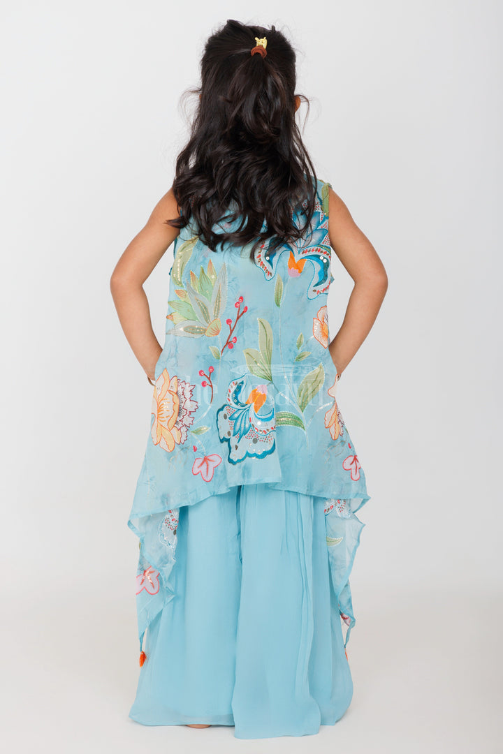 The Nesavu Girls Sharara / Plazo Set Girls Sky Blue Palazzo Set with Floral Embroidery and Tassel-Trimmed Sheer Jacket Nesavu Nesavu Girls Sky Blue Palazzo Set Floral Embroidered Crop Top Tassel Sheer Jacket