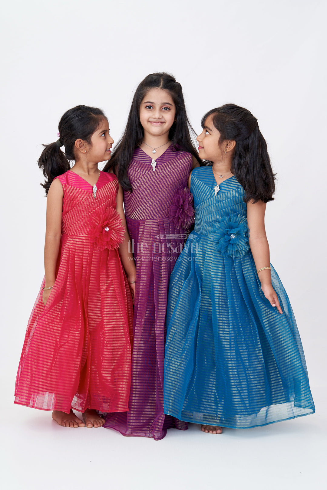 The Nesavu Girls Party Gown Girls Sleeveless Long Anarkali Dress in Softnet with Gold Shimmer Stripes and Elegant Floral Waist Accent Nesavu Girls Sleeveless Long Anarkali Dress Softnet Gold Shimmer Stripes Net Floral Accent | The Nesavu