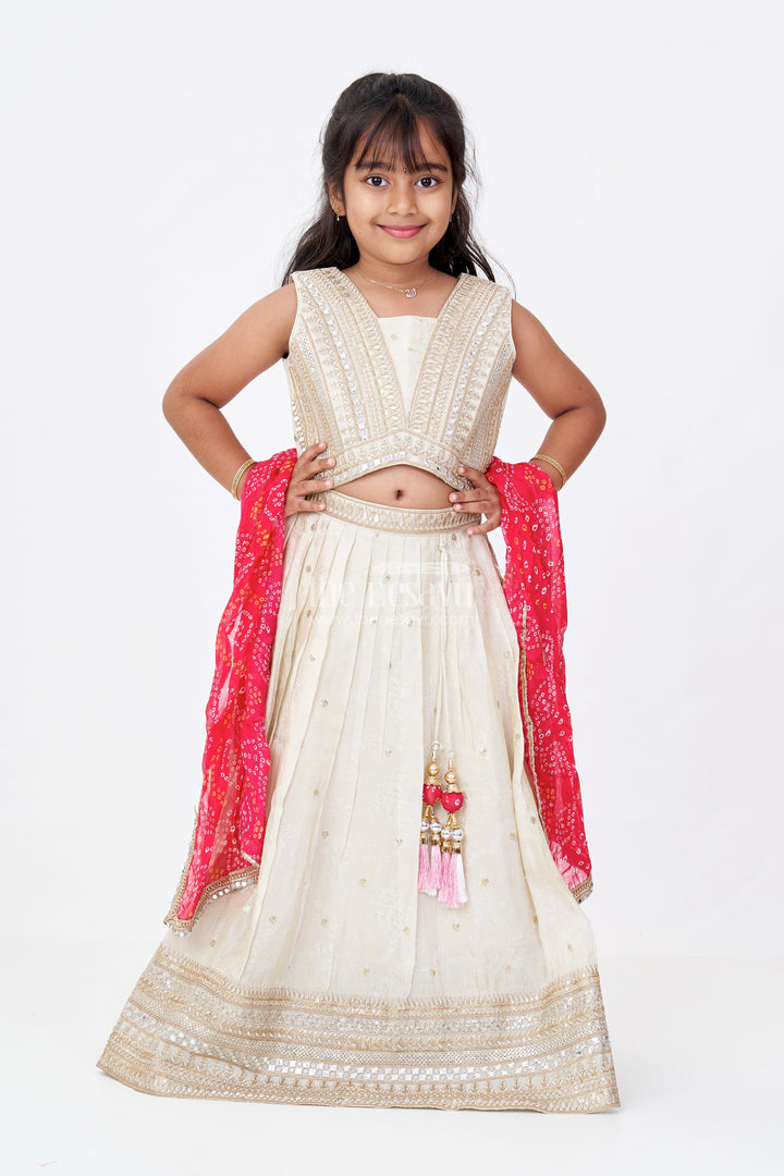 The Nesavu Girls Lehenga Choli Girls Traditional Gujarati Lehenga Choli in Cream with Mirror Work and Bandhani Dupatta Nesavu Girls Embroidered Traditional Gujarati Lehenga Choli Bandhani Dupatta | The Nesavu
