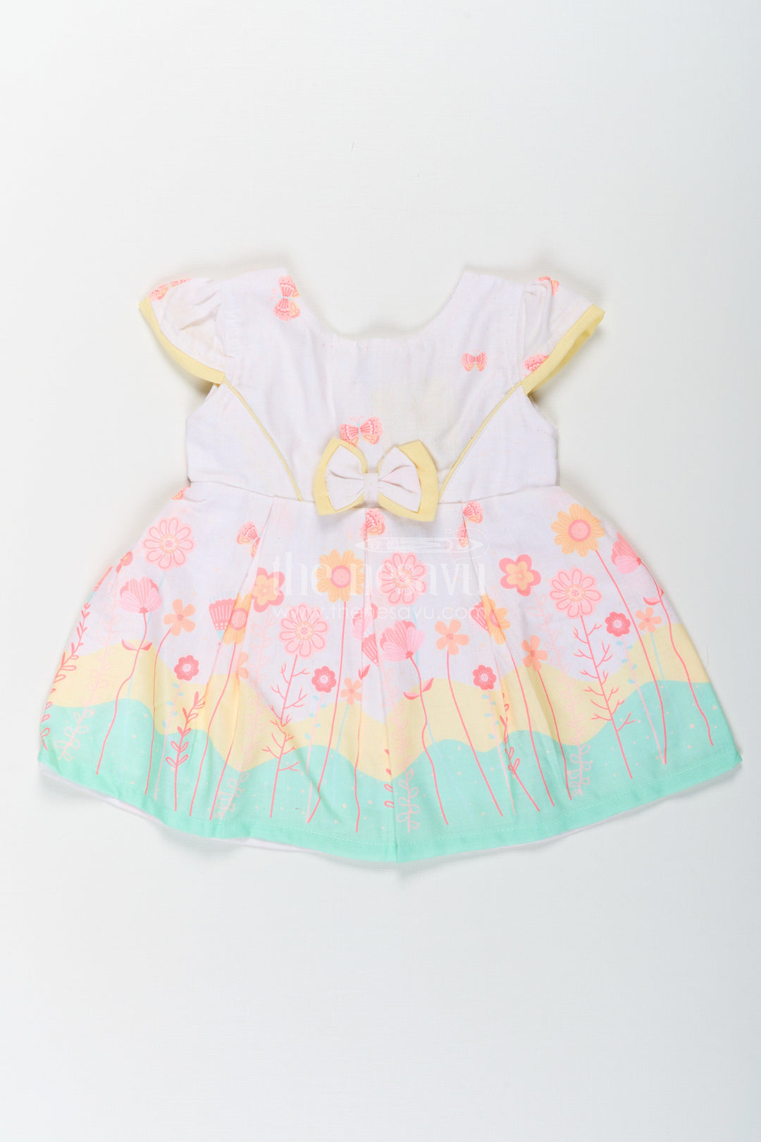The Nesavu Baby Cotton Frocks Girls Ugadi Special Frock Dress in Soft Cotton with Pastel Floral Print and Yellow Bow Detail Nesavu 14 (6M) / Yellow BFJ756A-14 Girls Cotton Ugadi Special Frock Dress Floral Print Yellow Waist Bow Festive Comfort | The Nesavu