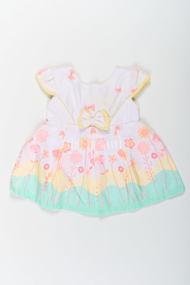 The Nesavu Baby Cotton Frocks Girls Ugadi Special Frock Dress in Soft Cotton with Pastel Floral Print and Yellow Bow Detail Nesavu 14 (6M) / Yellow BFJ756A-14 Girls Cotton Ugadi Special Frock Dress Floral Print Yellow Waist Bow Festive Comfort | The Nesavu