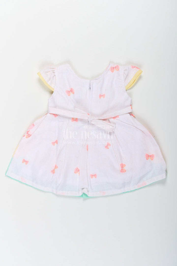 The Nesavu Baby Cotton Frocks Girls Ugadi Special Frock Dress in Soft Cotton with Pastel Floral Print and Yellow Bow Detail Nesavu Girls Cotton Ugadi Special Frock Dress Floral Print Yellow Waist Bow Festive Comfort | The Nesavu