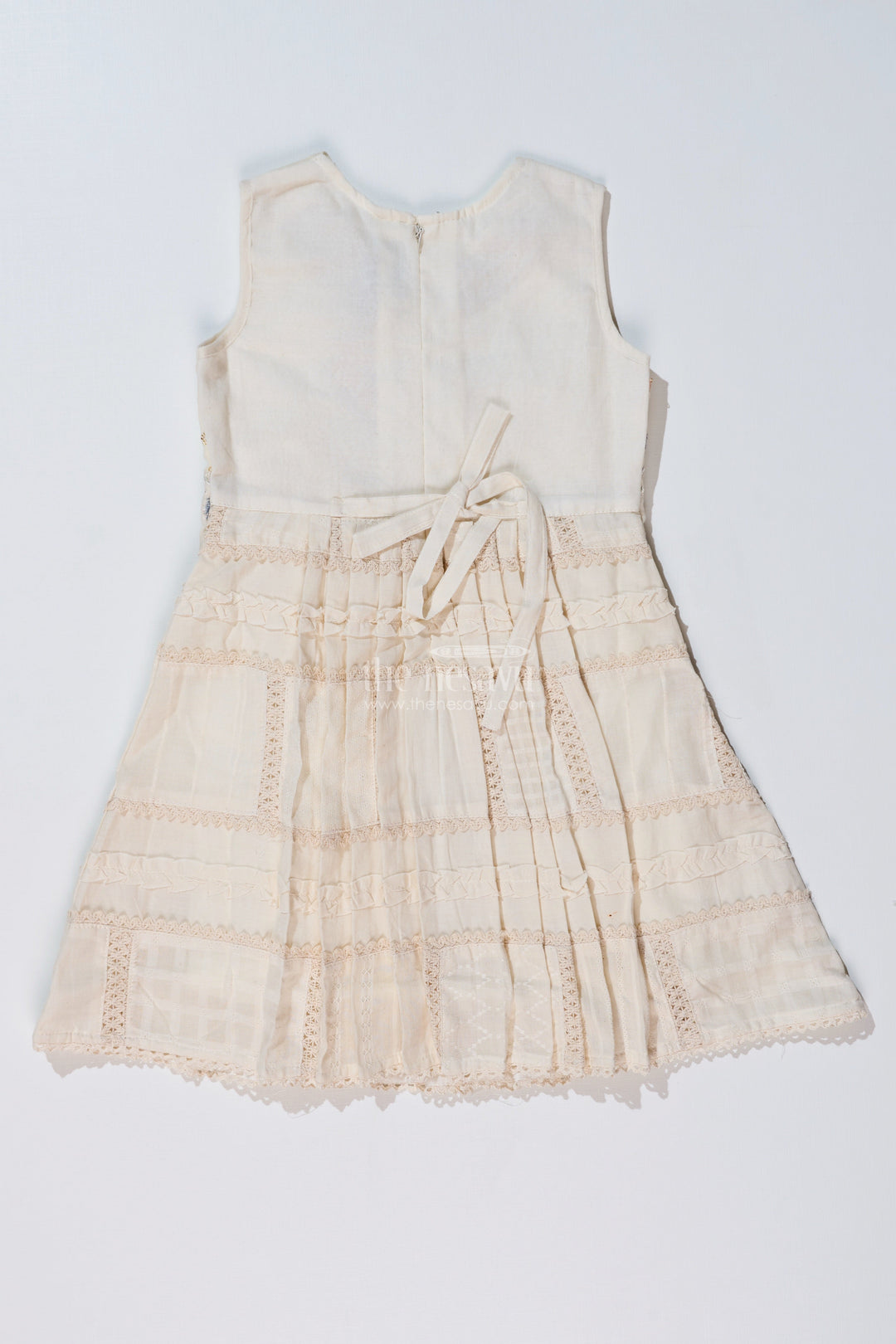 The Nesavu Girls Cotton Frock Girls White Color Frock with Embroidery and Layered Pleats for Graceful Festive Wear Nesavu Girls White Color Cotton Frock Embroidery Layered Pleats Festive Wear | The Nesavu