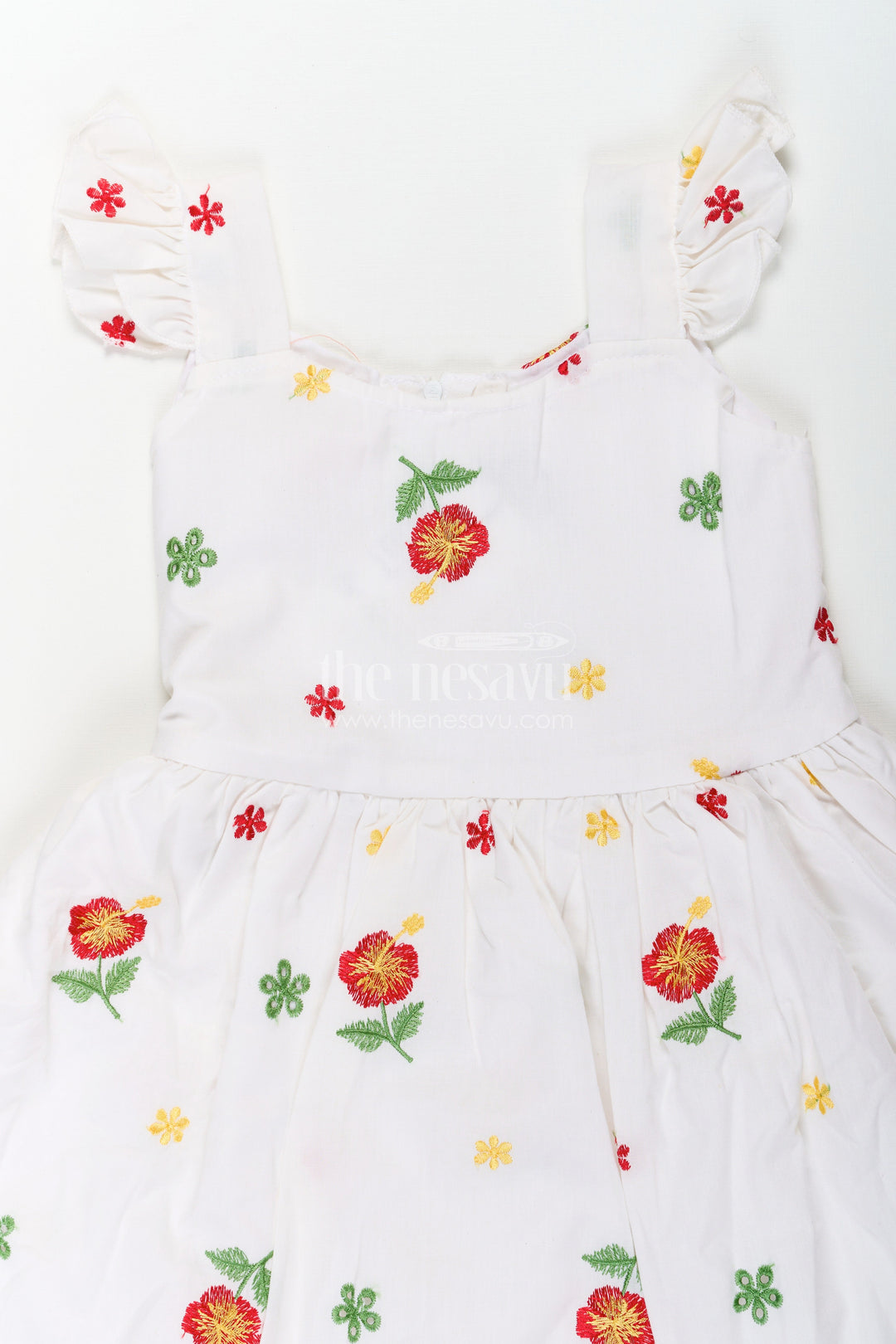 The Nesavu Girls Cotton Frock Girls White Floral Frock in Cotton Embroidery with Delicate Ruffles and Playful Design Nesavu Girls White Floral Frock Cotton Embroidery Ruffled Sleeves Flared Skirt | The Nesavu