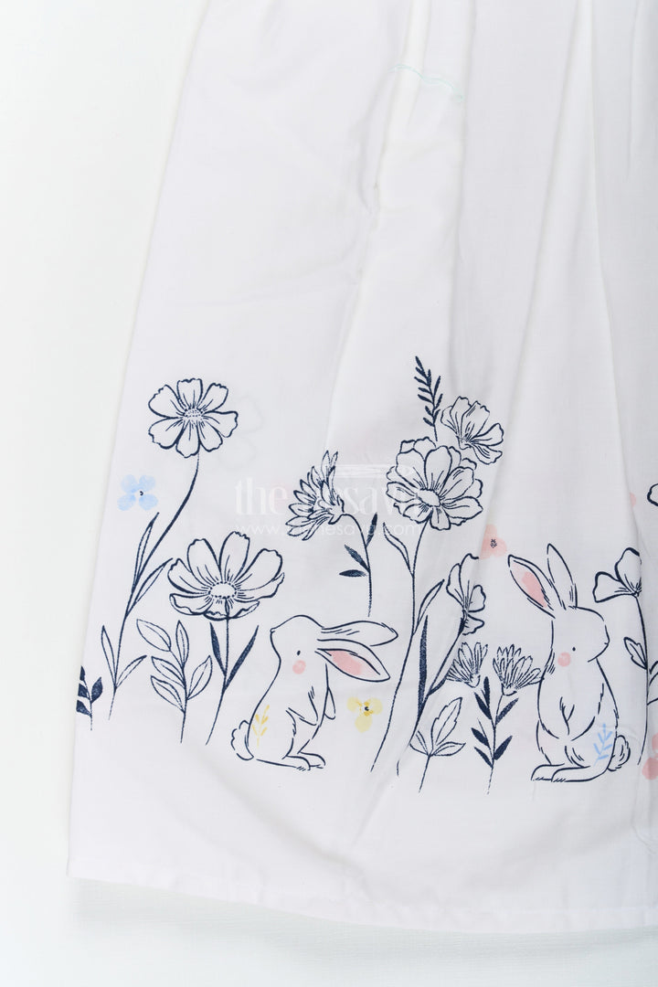 The Nesavu Girls Cotton Frock Girls White Frock Dress in Cotton with Digital Bunny Border and Pintuck Front Panel Nesavu Nesavu Girls White Frock Dress Cotton Digital Bunny Floral Border Pintuck Front