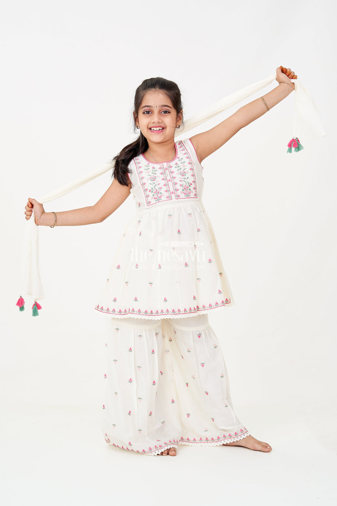The Nesavu Girls Sharara / Plazo Set Girls White Sharara Set with Floral Embroidered Cotton Kurti and Tassel Dupatta for Graceful Outings Nesavu 18 (2Y) / White GPS602A-18 Girls white sharara set Floral Cotton Embroidery Tassel Dupatta Festive Wear | The Nesavu
