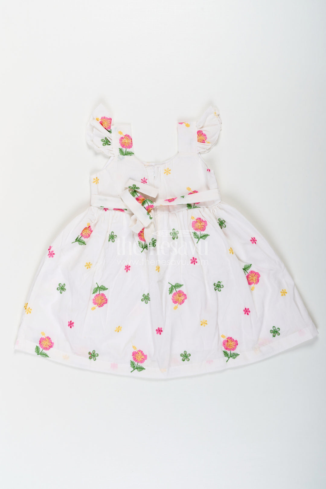 The Nesavu Girls Cotton Frock Girls White Short Frock in Cotton Embroidery with Floral Patterns and Ruffled Sleeves Nesavu Girls White Short Frock Cotton Embroidery Floral Patterns Ruffled Sleeves | The Nesavu