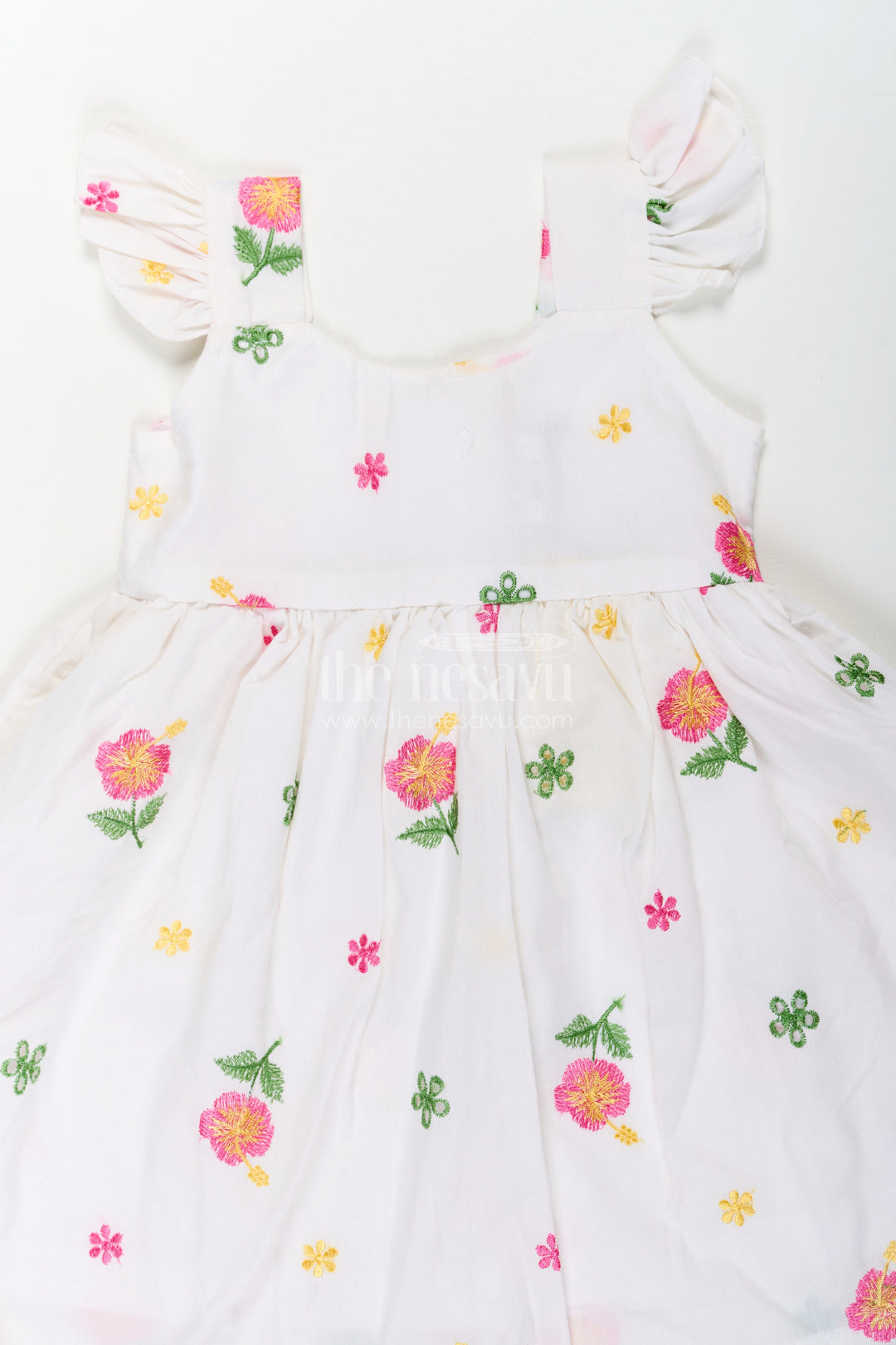 The Nesavu Girls Cotton Frock Girls White Short Frock in Cotton Embroidery with Floral Patterns and Ruffled Sleeves Nesavu Nesavu Girls White Short Frock Cotton Embroidery Floral Patterns Ruffled Sleeves