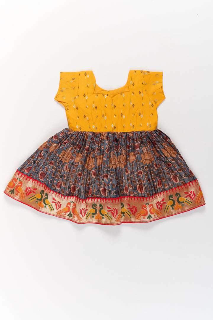 The Nesavu Silk Frock Girls Yellow Pattu Pavadai with Traditional Printed Border and Contrast Skirt for Festive Wear Nesavu 14 (6M) / Yellow SF958A-14 Girls Yellow Pattu Pavadai Traditional Printed Border Contrast Skirt Festive Occasions | The Nesavu
