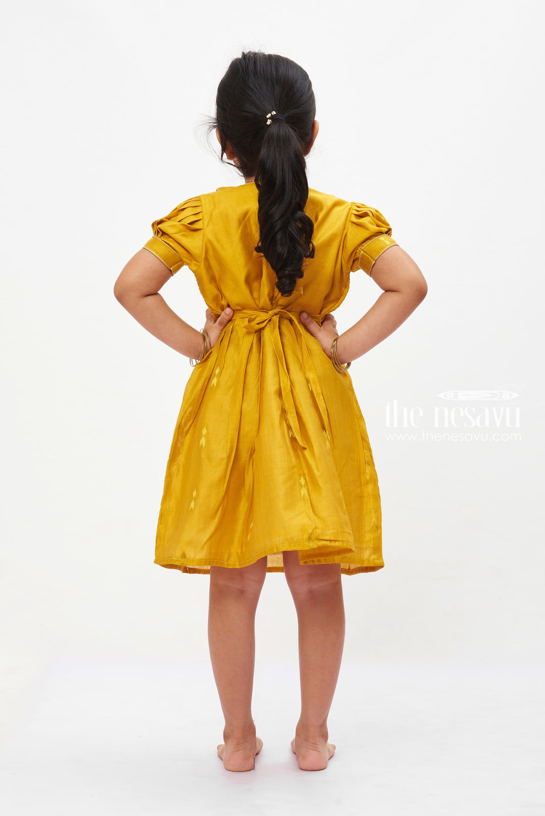 The Nesavu Girls Cotton Frock Golden Sunshine Puff Sleeve Dress: Girls' Mustard Yellow Frock with Shimmer Accents Nesavu Vibrant Mustard Yellow Girls Dress with Puff Sleeves | Shimmering Party Frock | The Nesavu