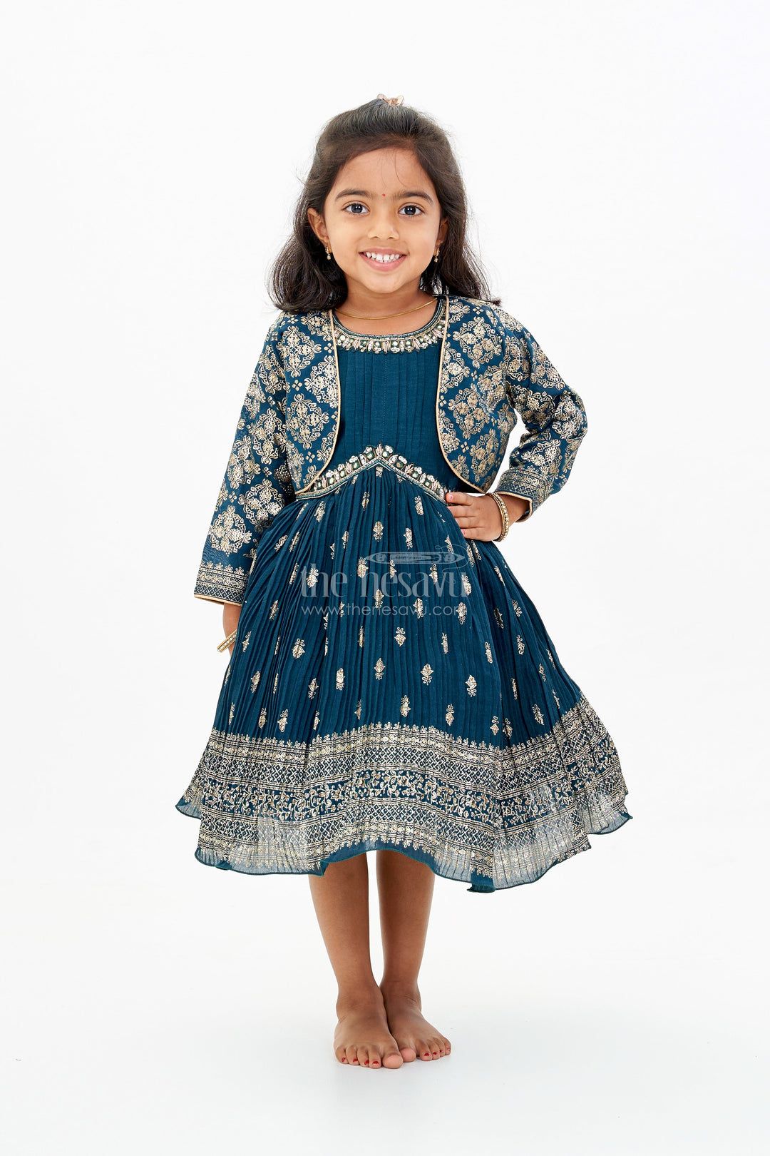 The Nesavu Silk Frock Graceful Girls Green Silk Dress with Gold Foil Prints and Traditional Embellished Yoke Nesavu Girls Green Silk Dress Gold Foil Prints Embroidered Yoke Special Occasions | The Nesavu