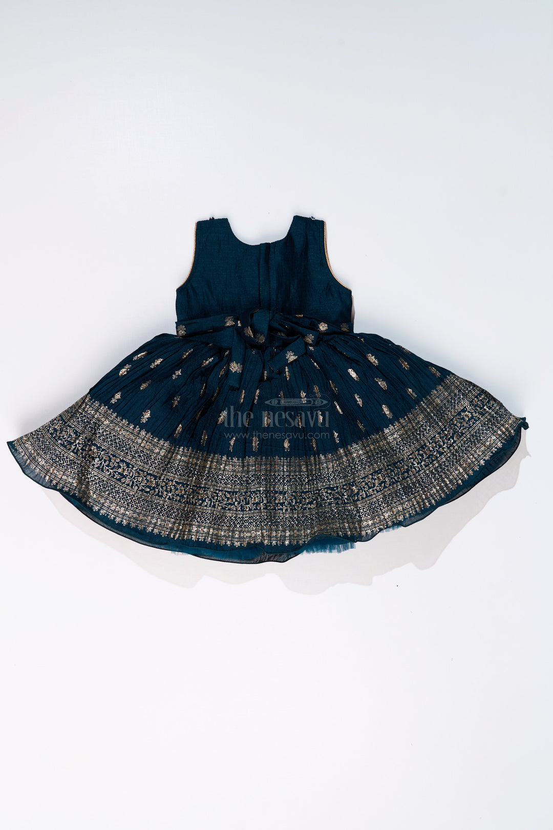 The Nesavu Silk Frock Graceful Girls Green Silk Dress with Gold Foil Prints and Traditional Embellished Yoke Nesavu Nesavu Girls Green Silk Dress Gold Foil Prints Embroidered Yoke Special Occasions