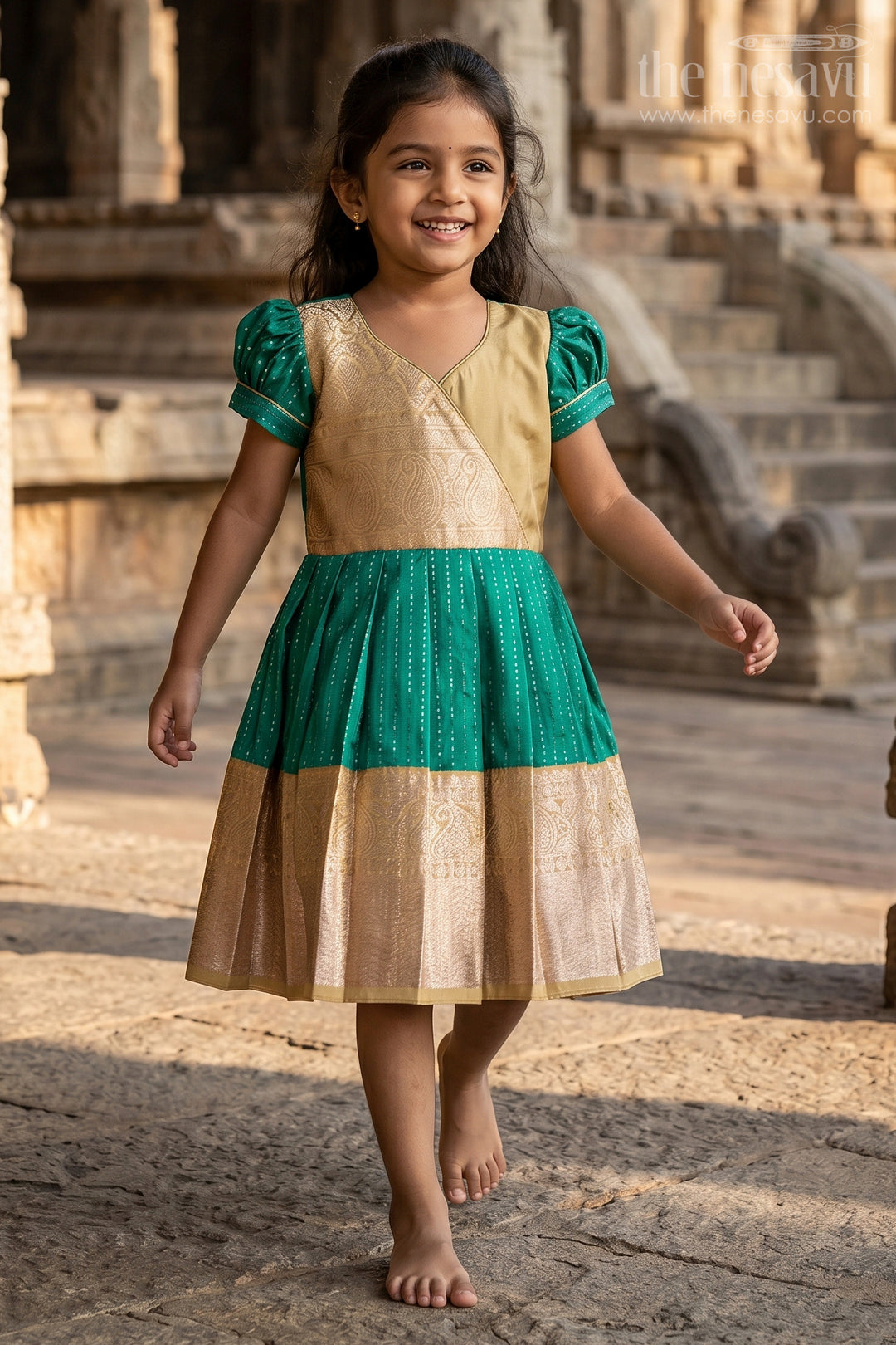 The Nesavu Girls Kanchi Silk Frock Graceful Green Silk Dress for Girls with Kanchipuram Inspired Fabric and Gold Zari Pleated Border Nesavu Green Silk Dress Girls Kanchipuram Inspired Fabric Gold Zari Pleated Border | The Nesavu