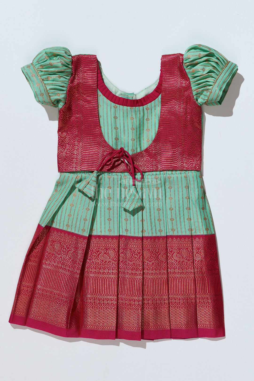 The Nesavu Girls Kanchi Silk Frock Graceful Light Green Silk Dress for Girls with Kanchipuram Inspired Design and Zari Pleated Border Nesavu Light Green Silk Dress Girls Kanchipuram Inspired Design Zari Pleated Border | The Nesavu