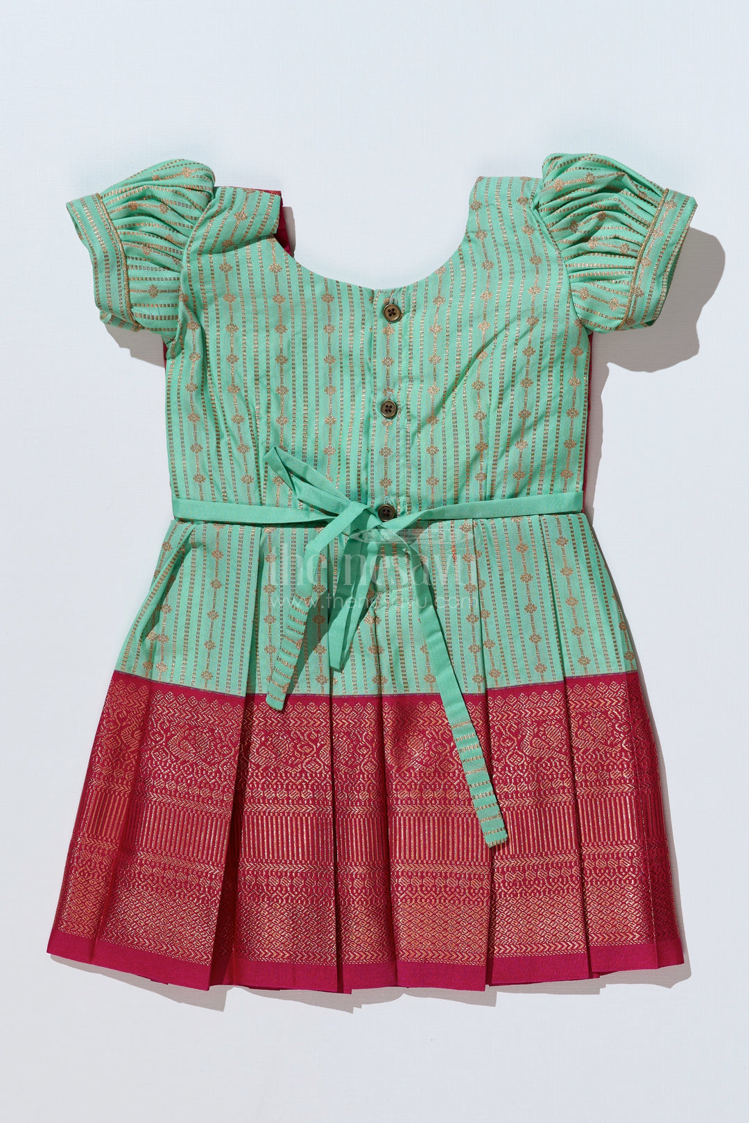 The Nesavu Girls Kanchi Silk Frock Graceful Light Green Silk Dress for Girls with Kanchipuram Inspired Design and Zari Pleated Border Nesavu Light Green Silk Dress Girls Kanchipuram Inspired Design Zari Pleated Border | The Nesavu