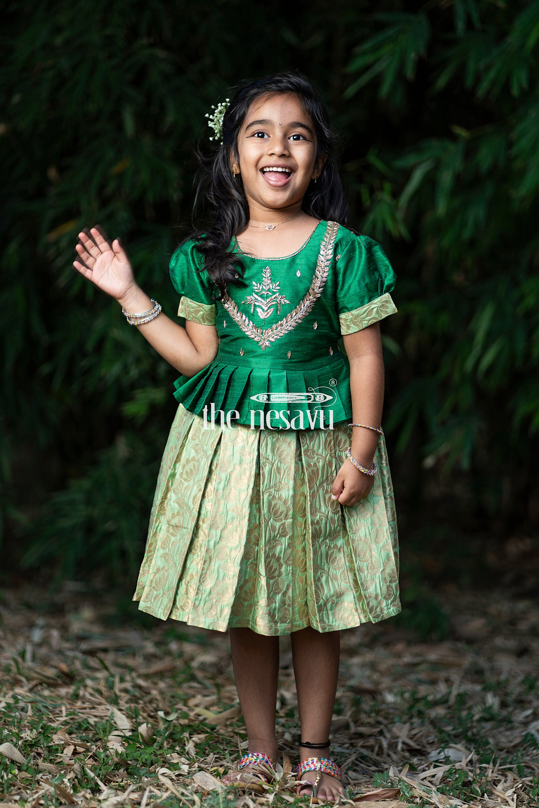 The Nesavu Silk Party Frock Green and Gold Banarasi Semi-Silk Dress for Girls - Perfect for Onam and Navratri Nesavu Green and Gold Banarasi Semi-Silk Dress for Girls - Onam and Navratri