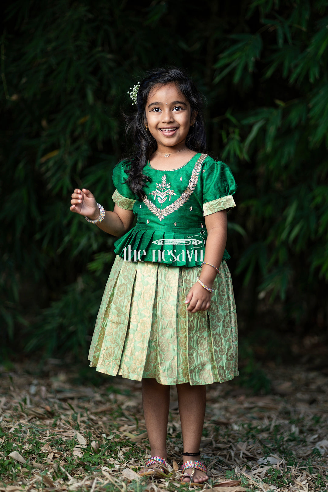 The Nesavu Silk Party Frock Green and Gold Banarasi Semi-Silk Dress for Girls - Perfect for Onam and Navratri Nesavu Green and Gold Banarasi Semi-Silk Dress for Girls - Onam and Navratri