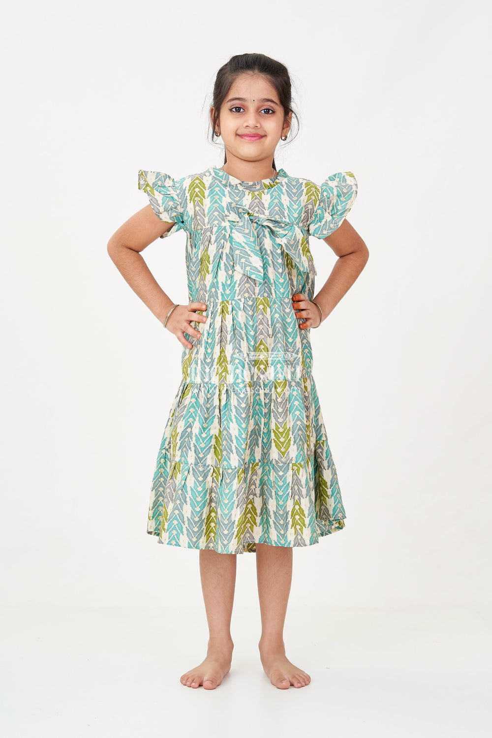 The Nesavu Girls Cotton Frock Green Colour Frock for Girls in Modal Silk with Multicolor Geometric Print and Front Bow Design Nesavu 18 (2Y) / Green GFC1696B-18 Nesavu Green Colour Frock Girls Modal Silk Multicolor Geometric Print Front Bow