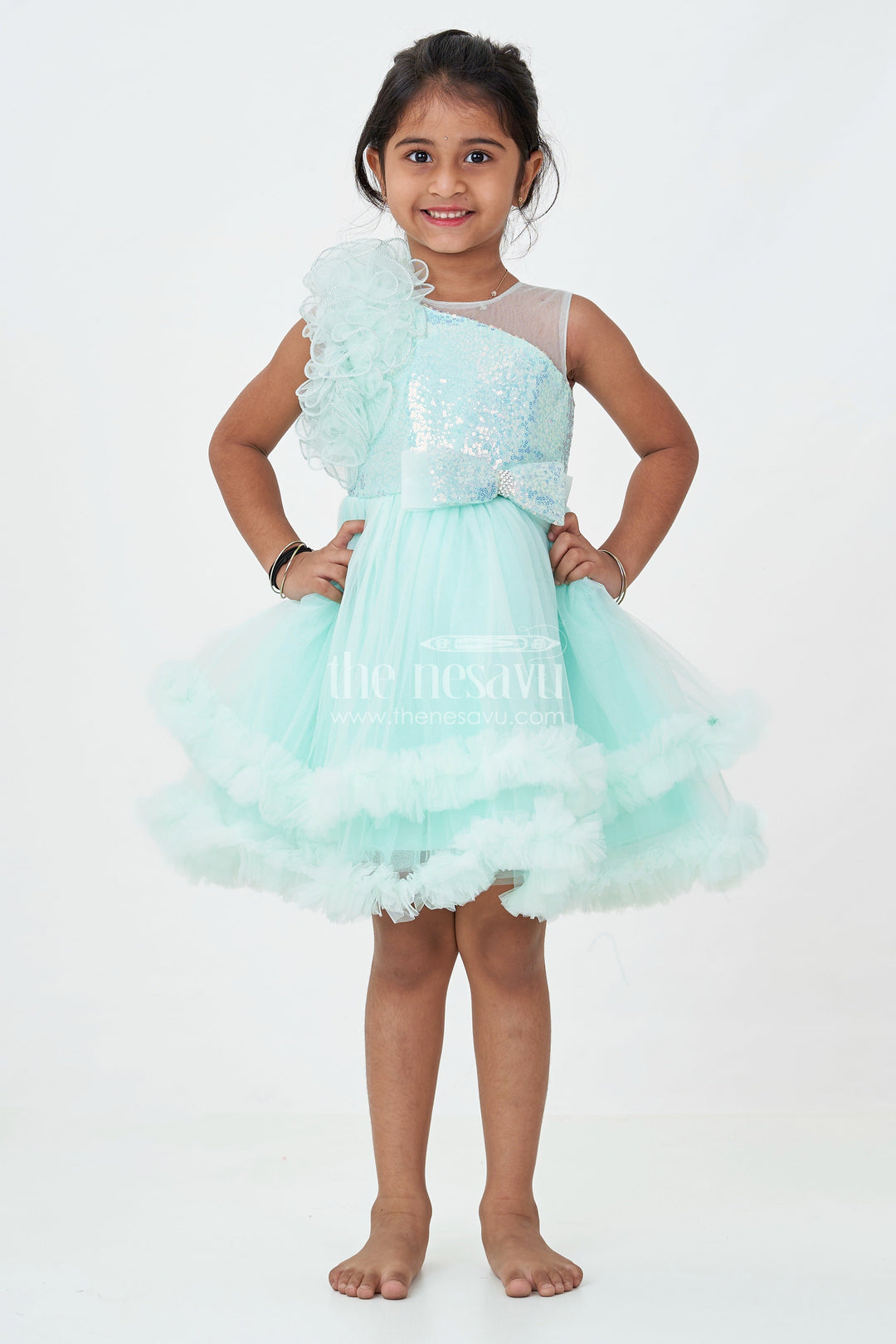 The Nesavu Girls Fancy Party Frock Green Party Dress for Girls in Net with Ruffle Layers and Sequin Embellished Floral Yoke Nesavu Green Party Dress Girls Net Floral Sequin Yoke Layered Ruffle Skirt | The Nesavu