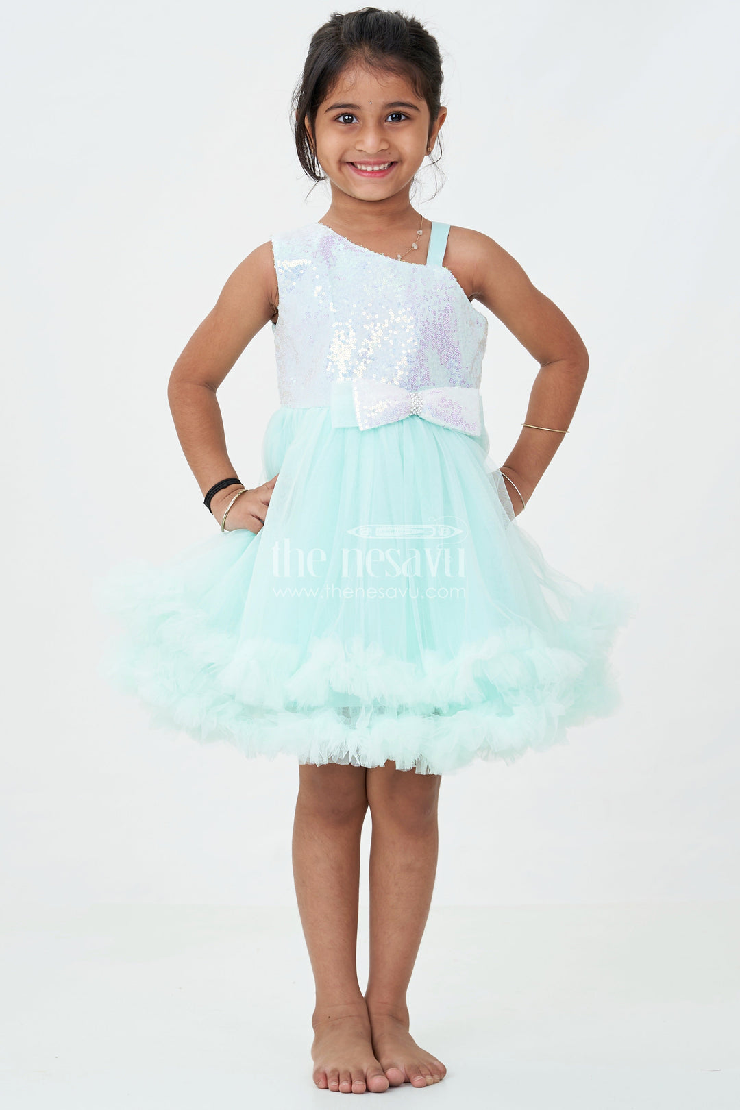 The Nesavu Girls Fancy Party Frock Green Party Dress Short for Girls in Net with Sparkle Yoke and Elegant Tulle Ruffle Skirt Nesavu Green Party Dress Short Girls Sequin Yoke Layered Net Skirt | The Nesavu