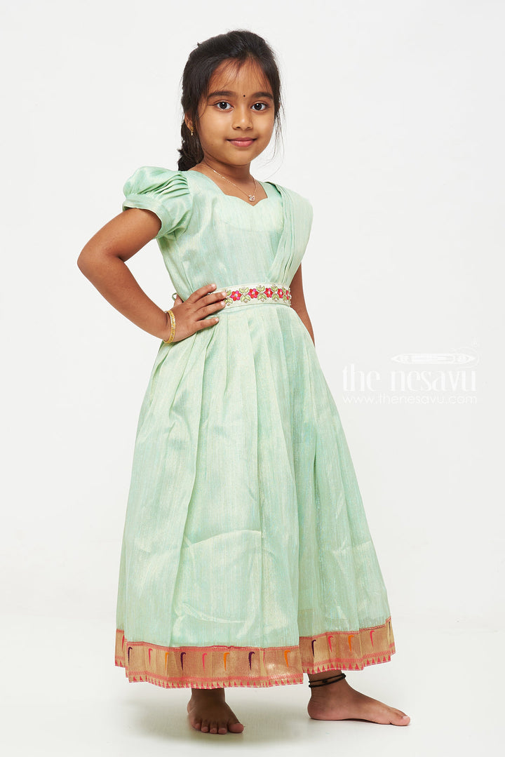 The Nesavu Girls Silk Gown Green Tissue Fabric Saree Gown for Girls with Embroidered Hip Belt Nesavu