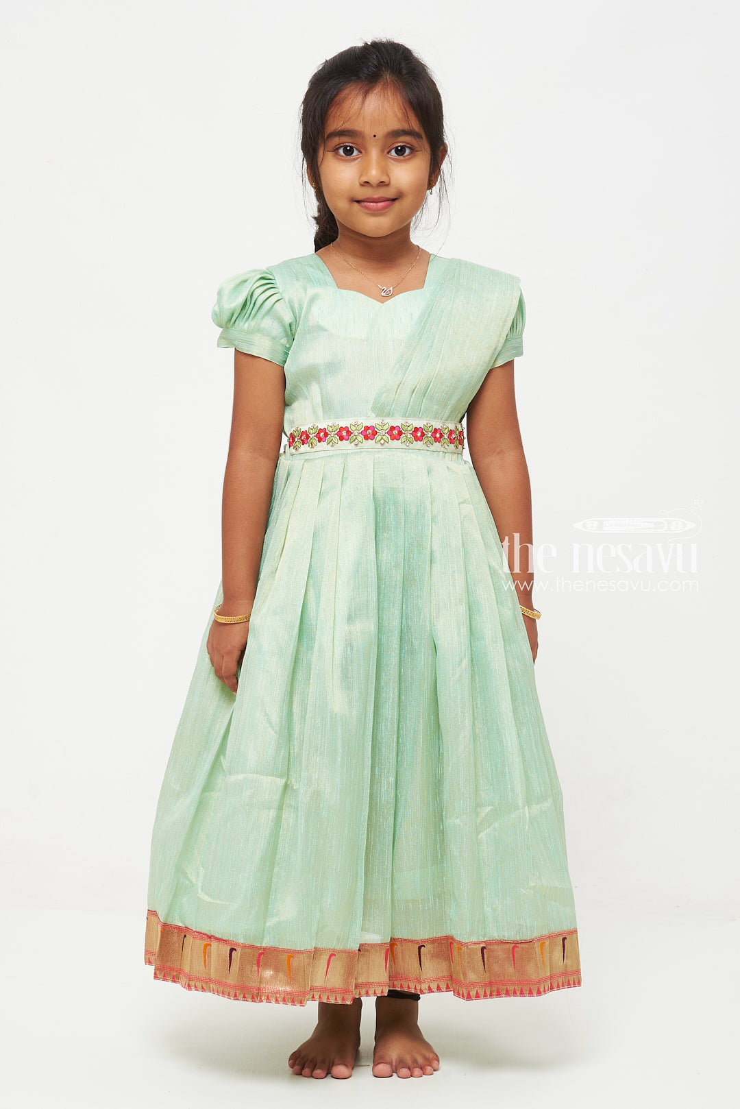 The Nesavu Girls Silk Gown Green Tissue Fabric Saree Gown for Girls with Embroidered Hip Belt Nesavu