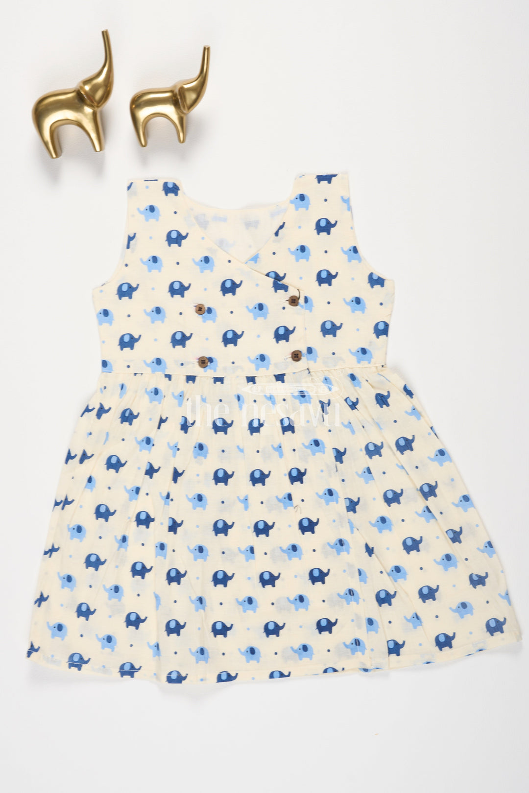 The Nesavu Baby Cotton Frocks Indigo Elephant Motif Baby Cotton Frock with Mockwrap Neckline and Button Detail Nesavu 10 (NB) / Cream BFJ617E-10 Indigo Elephant Motif Baby Cotton Frock with Mockwrap Neckline and Button Detail Nesavu