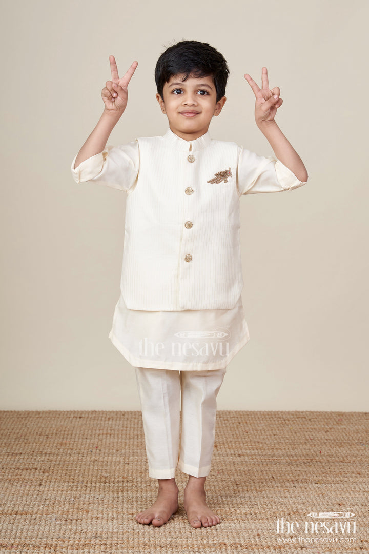 The Nesavu Boys Kurtha Set Ivory Kurta Set for Boys in Silk Blend with Designer Brooch Embellishment and Straight-Cut Pants Nesavu 16 (1Y) / Cream BCS235A-16 Ivory Kurta Set for Boys in Silk Blend with Brooch Embellishment and Stylish Jacket Design | The Nesavu
