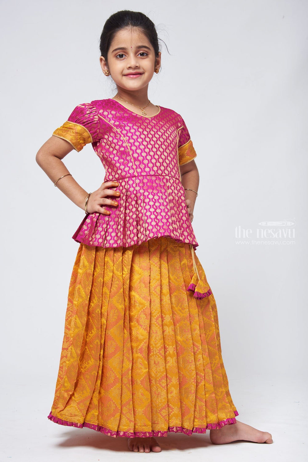 The Nesavu Pattu Pavadai Lavish Brocade Purple Peplum Top with Banarasi Yellow Silk Pavadai: South Indian Elegance Nesavu Pattu Pavadai with peplum blouse | Pattu Pavadai Latest Design | The Nesavu