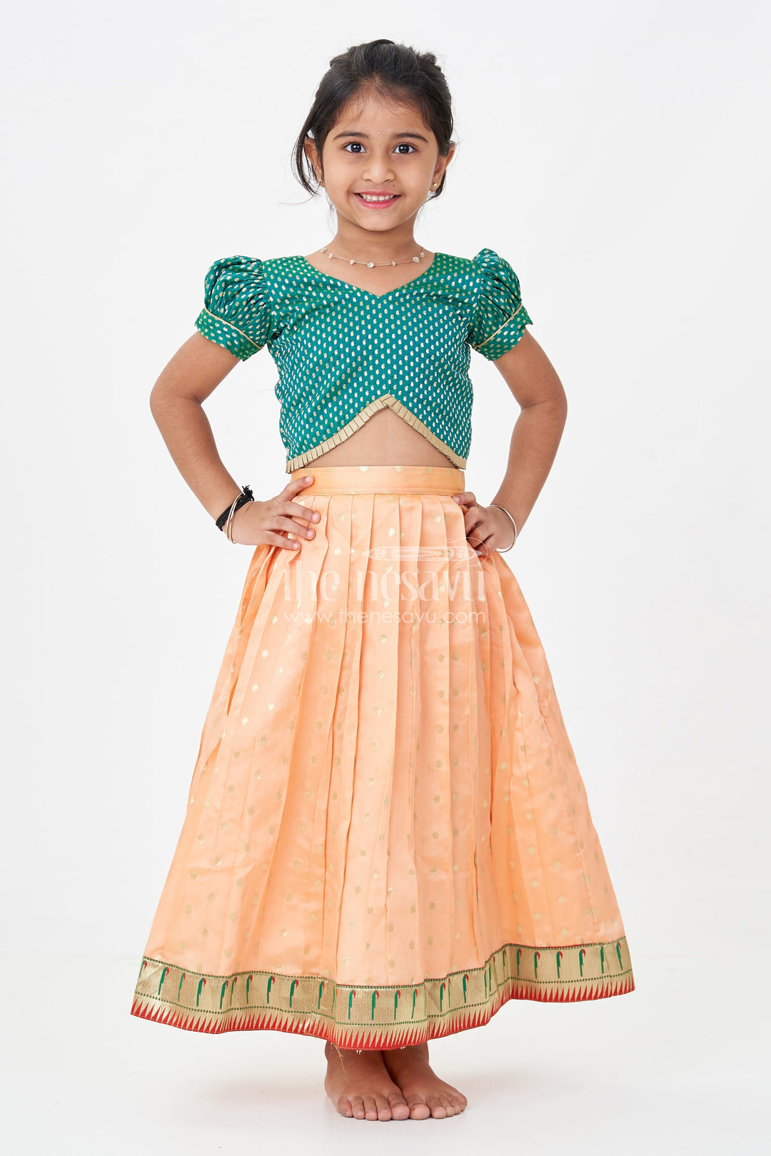 The Nesavu Pattu Pavadai Lehenga Pattu Pavadai for Girls in Orange and Green with Paithani Embellished Banaras Skirt Nesavu Lehenga Pattu Pavadai Girls Semi Banaras Skirt Paithani Border Orange Green | The Nesavu