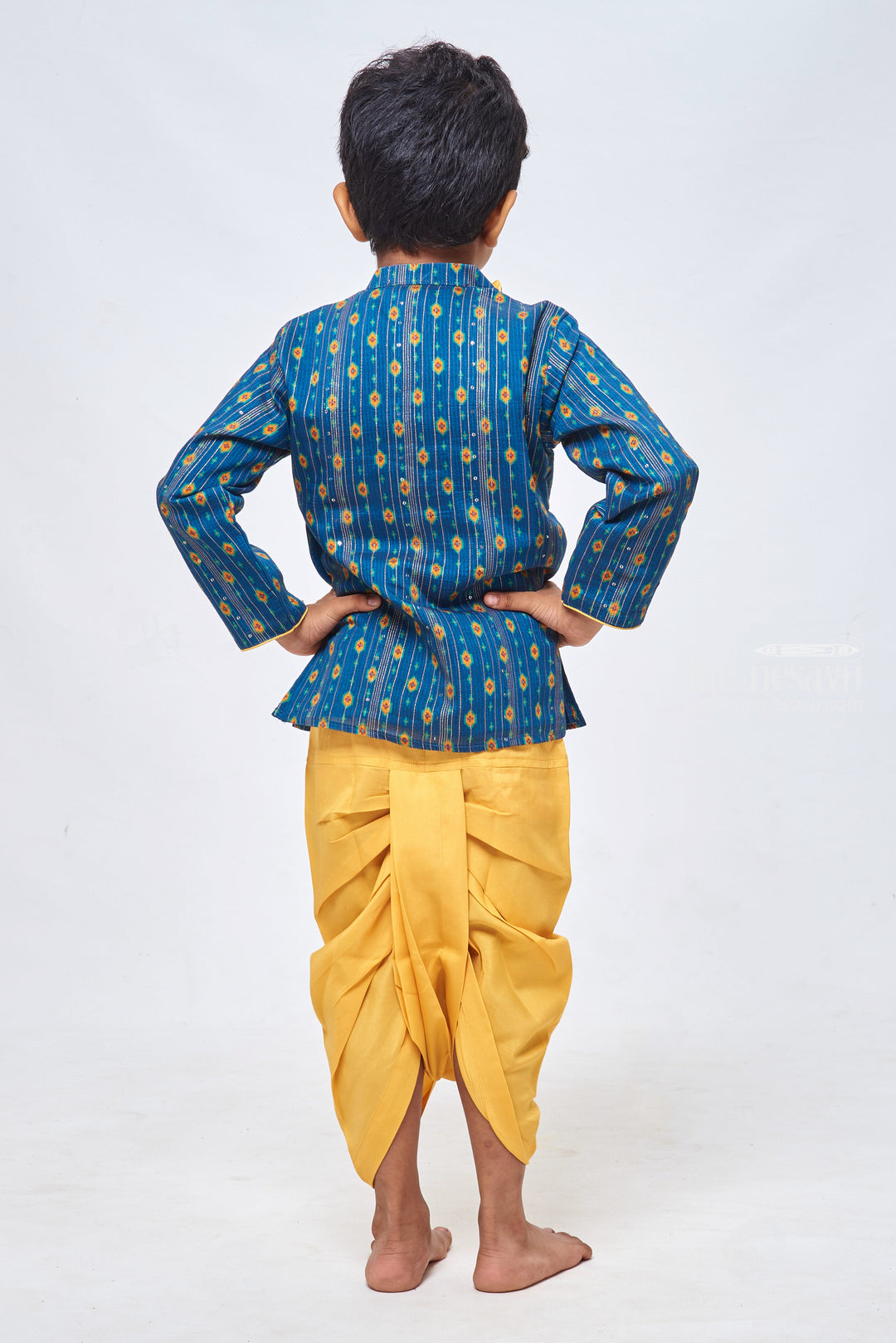 The Nesavu Boys Dothi Set Lustrous Blue Kurta: Embellished with Lurex Zari and Sequin Paired with Yellow Panchagajam Dothi Nesavu Designer Boys Ethnic Outfit | Boys Ethnic Kurta and Panchagajam Set | The Nesavu