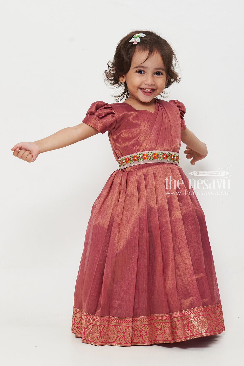 The Nesavu Girls Silk Gown Magenta Tissue Fabric Saree Gown for Girls with Embroidered Hip Belt Nesavu