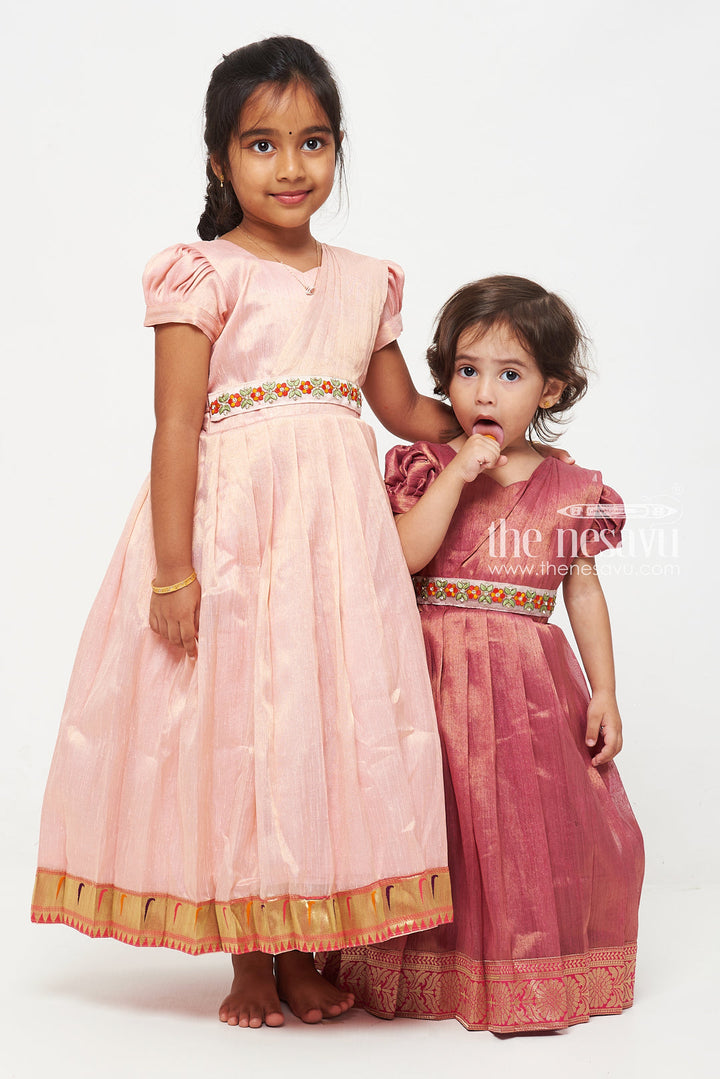 The Nesavu Girls Silk Gown Magenta Tissue Fabric Saree Gown for Girls with Embroidered Hip Belt Nesavu