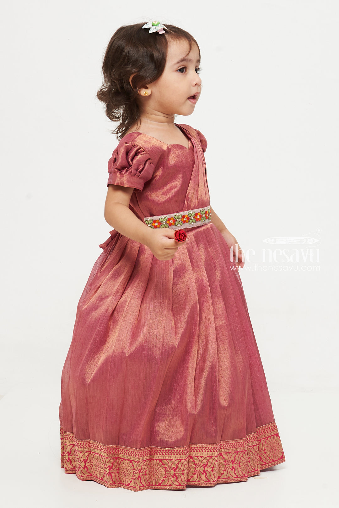 The Nesavu Girls Silk Gown Magenta Tissue Fabric Saree Gown for Girls with Embroidered Hip Belt Nesavu